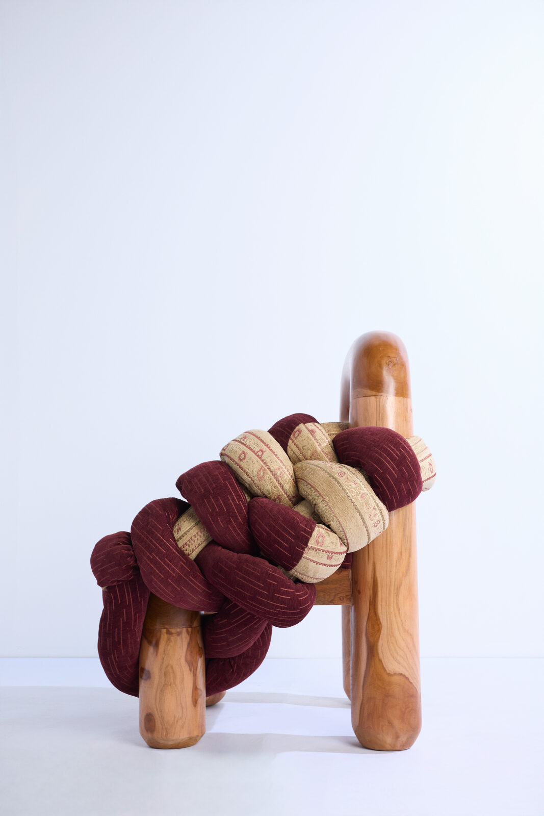 Apo Chair, a knotted-yarn armchair on a wooden arch frame