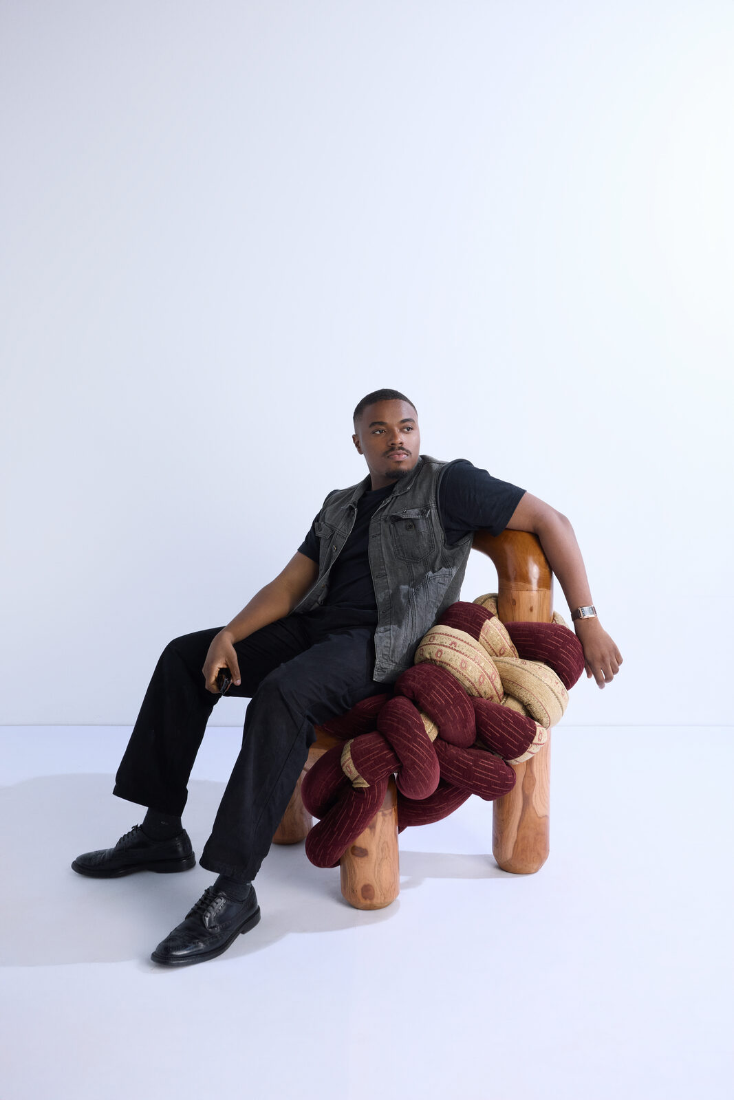 Seated in the Apo Chair at an exhibition