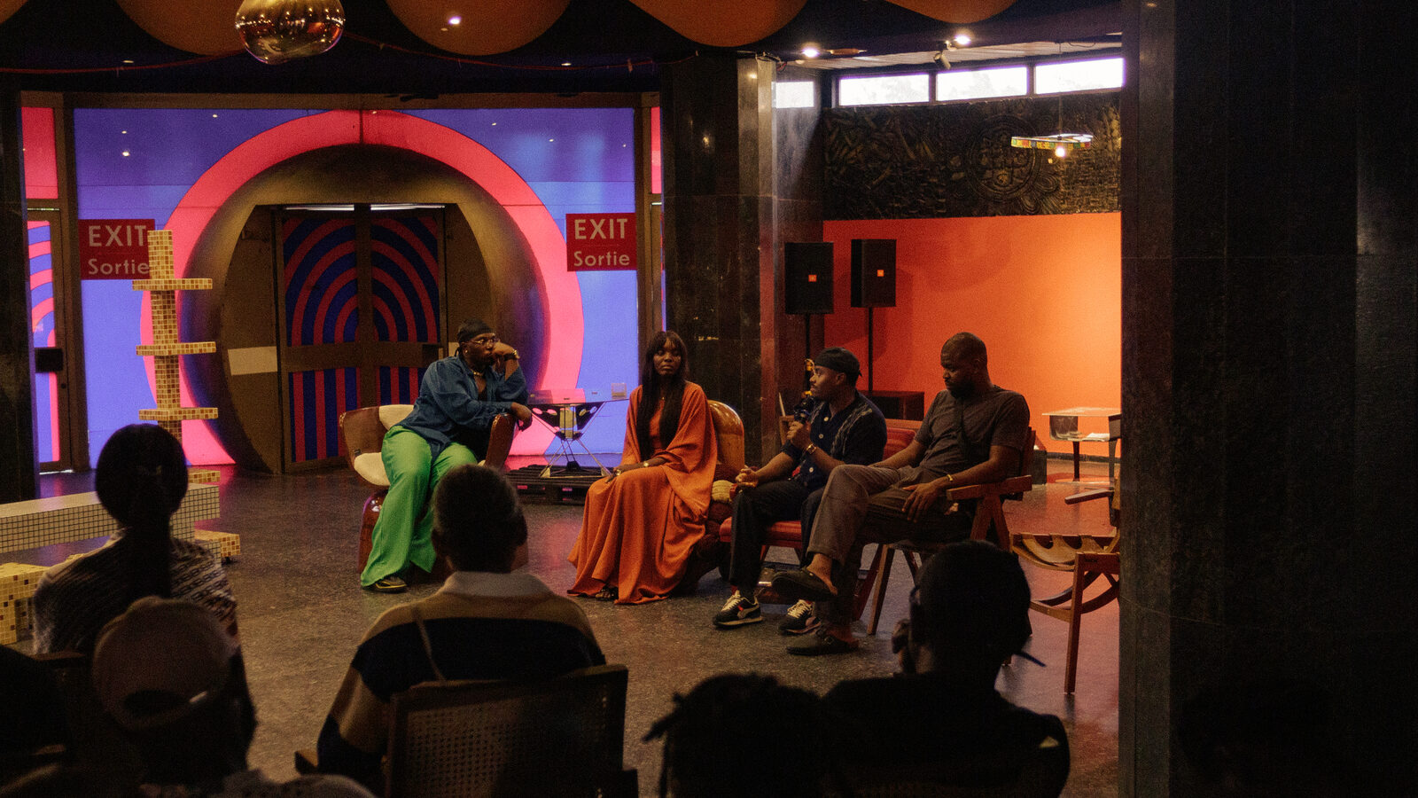 Panel discussion in a colourful event space