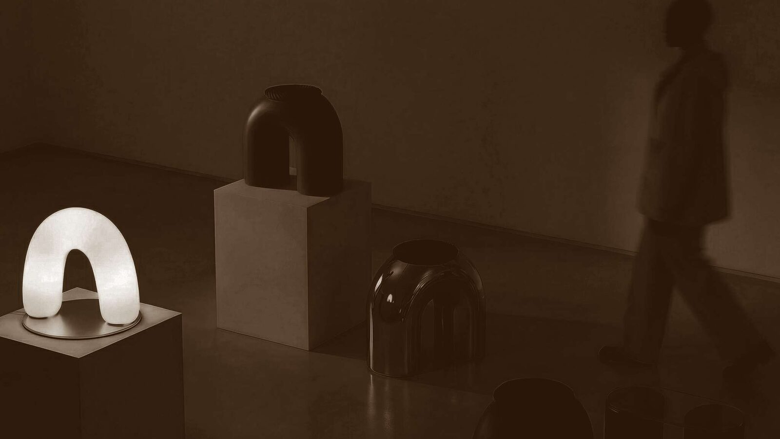 Apo Lamp and Apo Stool installed in a warm-lit gallery space