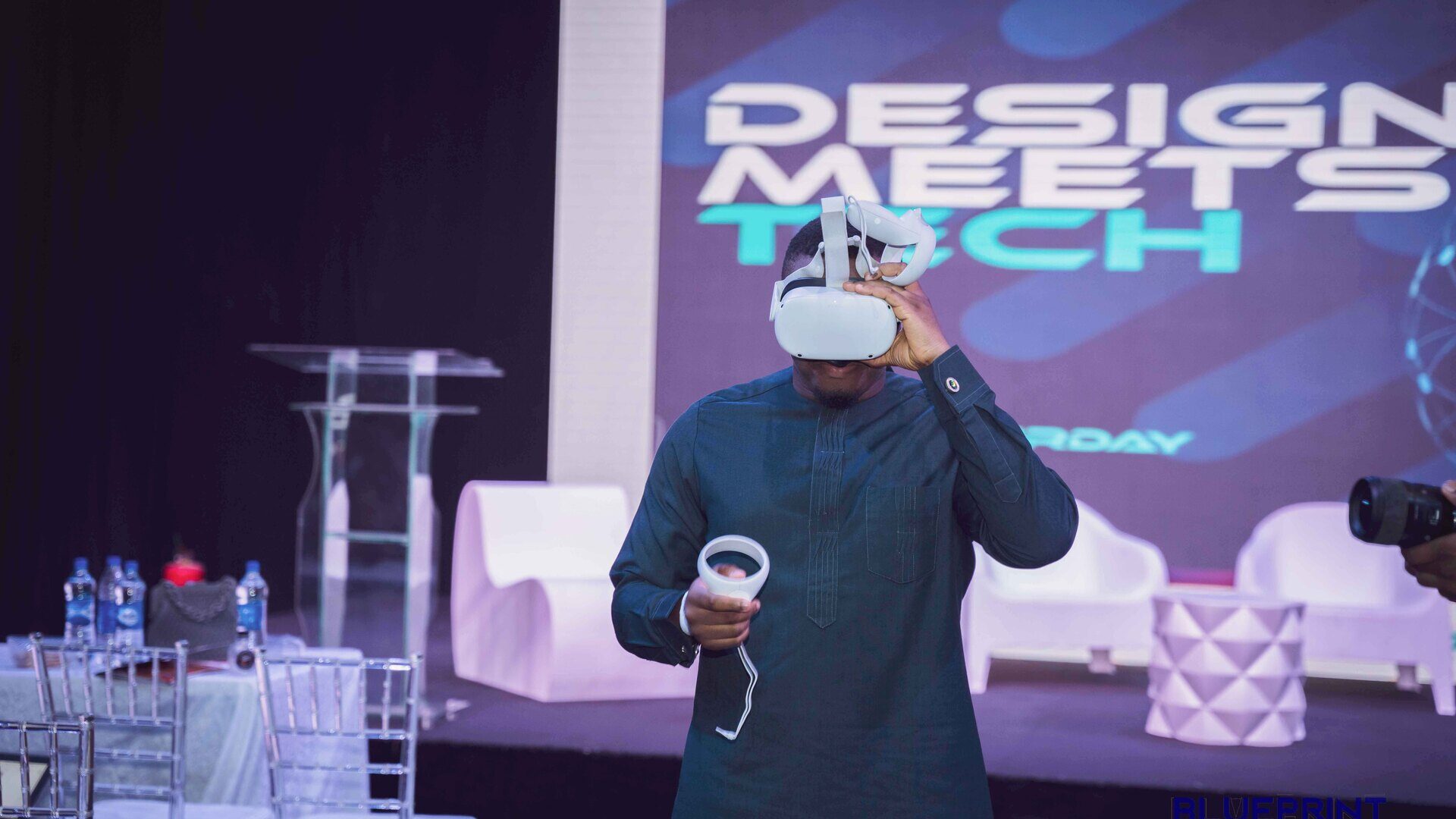 Demonstrating a VR headset on stage
