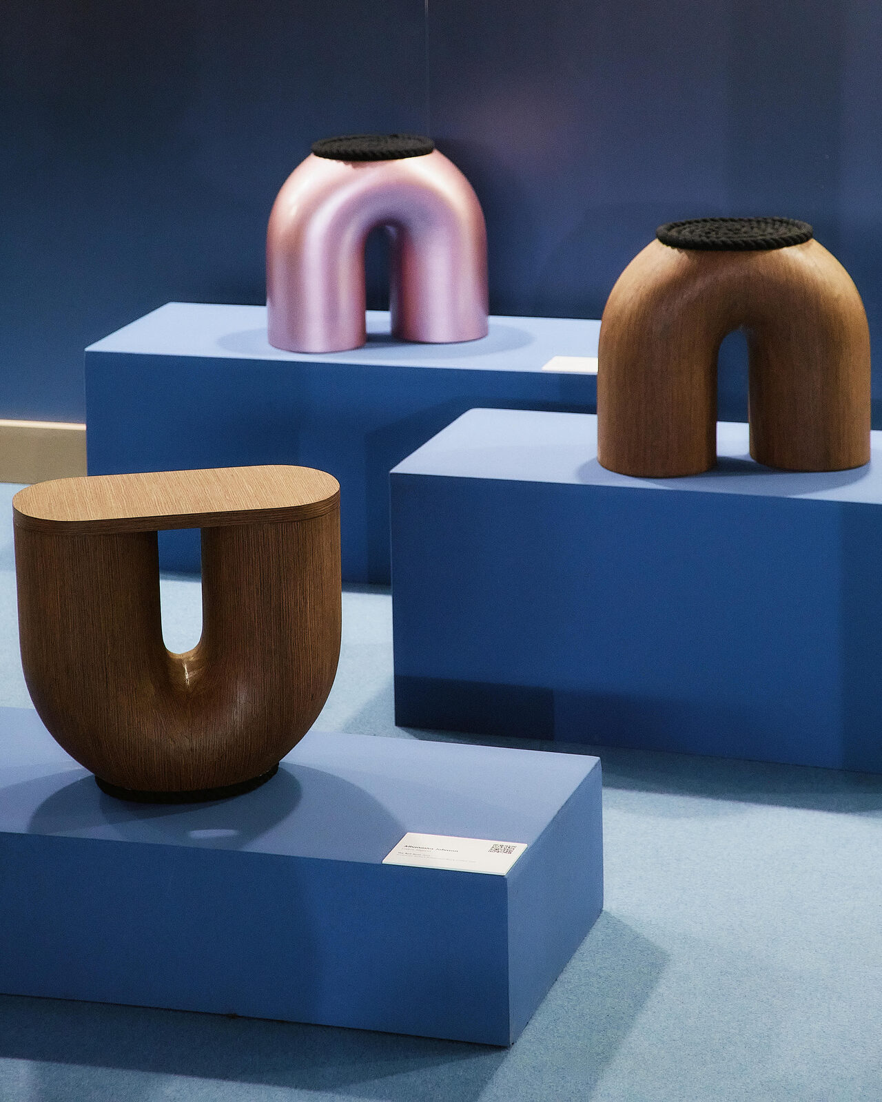 Apo Stools in wood and pink-polished steel, exhibited at Milan Design Week